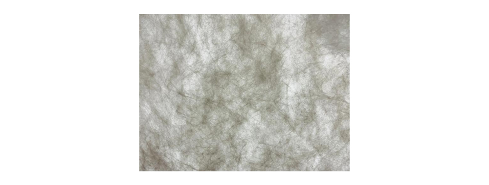Micro close‑up view of interlaced continuous fibrous network structure of Tyvek® non‑woven material