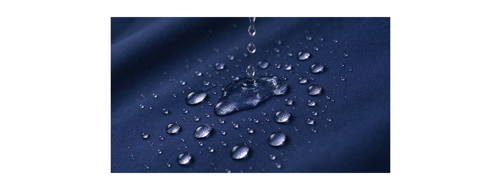 Water droplets beading on waterproof Oxford fabric surface
