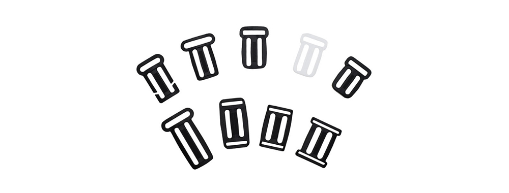 Multiple plastic end‑release side adjuster buckles for webbing