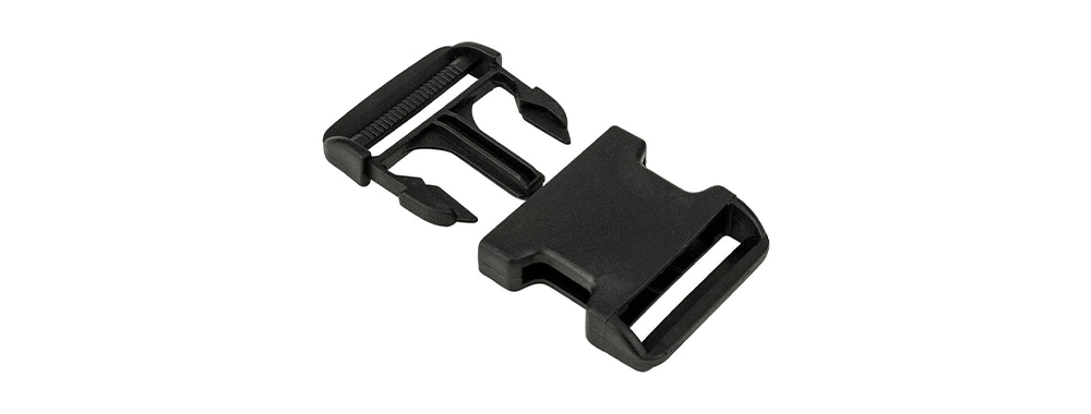 .Black plastic side‑release buckle, connector for backpack sternum strap, waist belt and main compartment